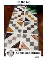 In the Air # CSS338 From Creek Side Stitches Placemats, Table Runners & Toppers Size: 17" X 53"  assorted 5" squares