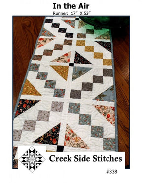 In the Air # CSS338 From Creek Side Stitches Placemats, Table Runners & Toppers Size: 17" X 53"  assorted 5" squares