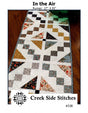 In the Air # CSS338 From Creek Side Stitches Placemats, Table Runners & Toppers Size: 17" X 53"  assorted 5" squares