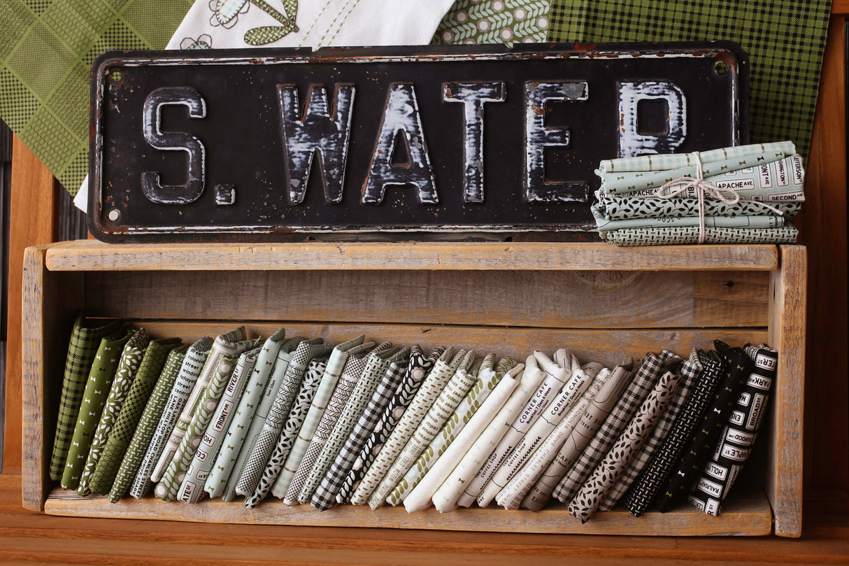 Main Street Street Signs Black Yardage 55643-25 by Sweetwater for Moda Fabrics Sold In 1/2 yard increments cut continuously