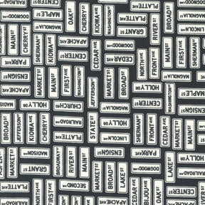 Main Street Street Signs Black Yardage 55643-25 by Sweetwater for Moda Fabrics Sold In 1/2 yard increments cut continuously
