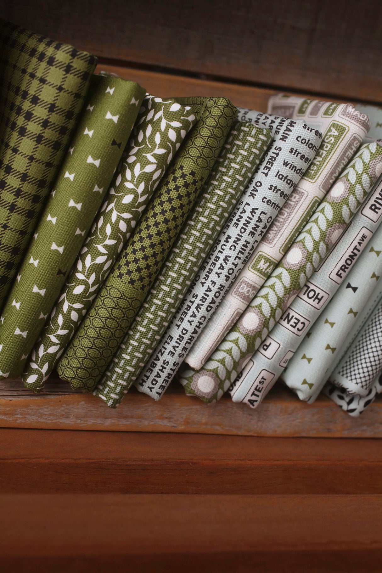 Main Street Street Signs Black Yardage 55643-25 by Sweetwater for Moda Fabrics Sold In 1/2 yard increments cut continuously
